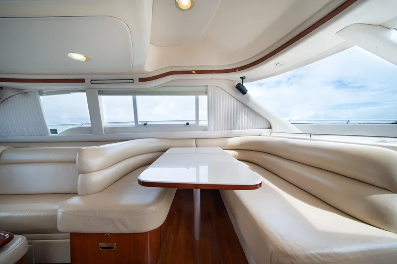 Slide: The Image of Luxurious interior of 2003 Sea Ray 480 Sedan Bridge yacht with cream leather seating. - 22