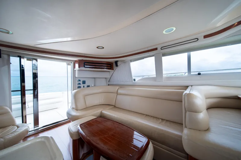 Slide: The Image of Luxurious interior of 2003 Sea Ray 480 Sedan Bridge yacht with leather seating and ocean view. - 25