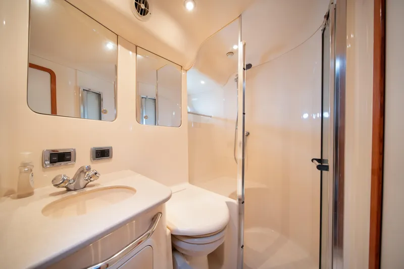 Slide: The Image of Luxurious bathroom in 2003 Sea Ray 480 Sedan Bridge yacht with shower and vanity. - 31