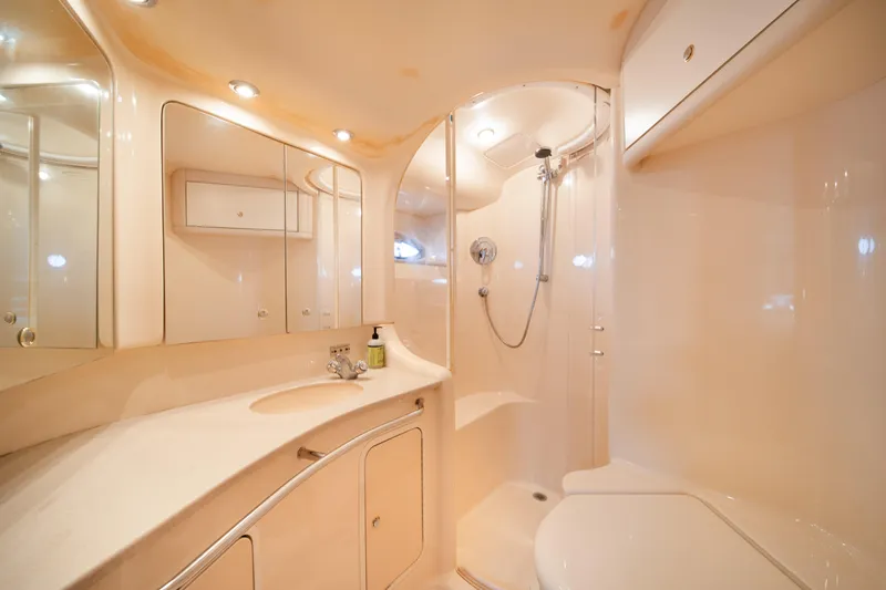 Slide: The Image of Luxurious bathroom in 2003 Sea Ray 480 Sedan Bridge yacht, featuring modern fixtures and elegant design. - 32