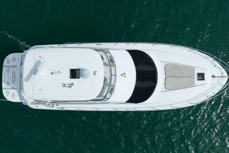 Slide: The Image of Aerial view of 2003 Sea Ray 480 Sedan Bridge yacht on clear water. - 9