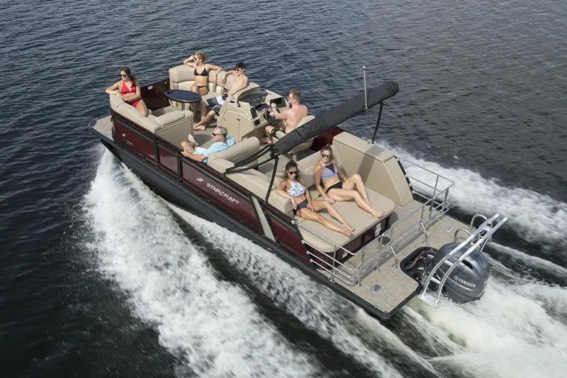 The Image of Manufacturer Provided Image: 2022 Starcraft CX 23 Q pontoon boat cruising with passengers on a lake. - 0