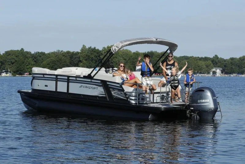 Slide: The Image of Manufacturer Provided Image: 2022 Starcraft CX 23 Q pontoon boat with family on a lake. - 4