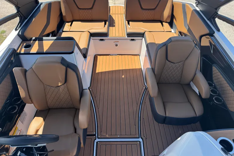 Slide: The Image of 2026 Yamaha Boats 252SD interior with luxurious tan seating and sleek design. - 15
