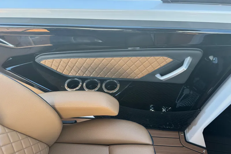 Slide: The Image of Luxurious interior of 2026 Yamaha Boats 252SD with quilted leather and cup holders. - 17