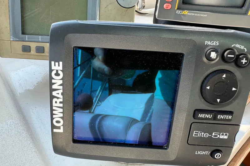 Slide: The Image of Lowrance Elite-5m HD marine GPS on 1985 Silverton 40 Aft Cabin boat dashboard. - 10