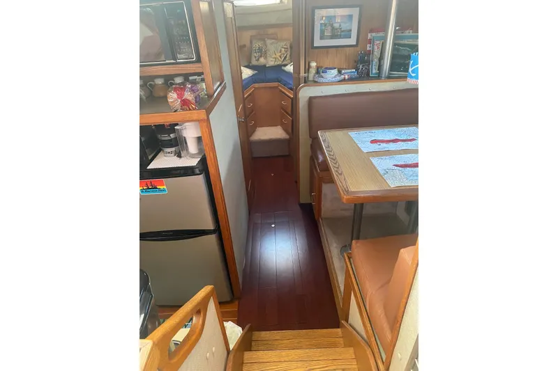Slide: The Image of Interior of 1985 Silverton 40 Aft Cabin with kitchen and dining area. - 20