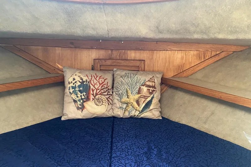Slide: The Image of Cozy cabin interior of 1985 Silverton 40 Aft Cabin with nautical-themed pillows. - 37