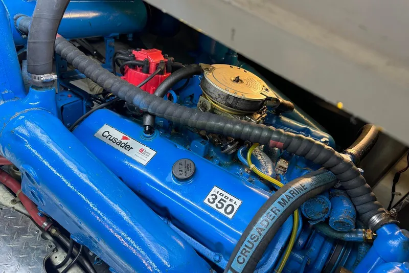 Slide: The Image of Engine of a 1985 Silverton 40 Aft Cabin boat, featuring a Crusader Model 350. - 44