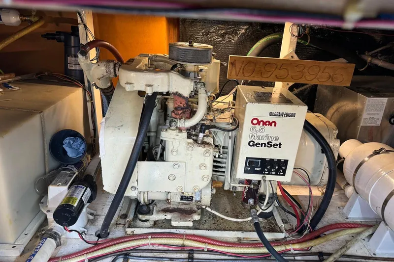 Slide: The Image of Engine room of 1985 Silverton 40 Aft Cabin with Onan 6.5 Marine GenSet. - 47