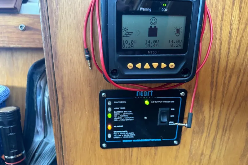 Slide: The Image of Control panel on a 1985 Silverton 40 Aft Cabin boat, displaying voltage and battery status. - 51