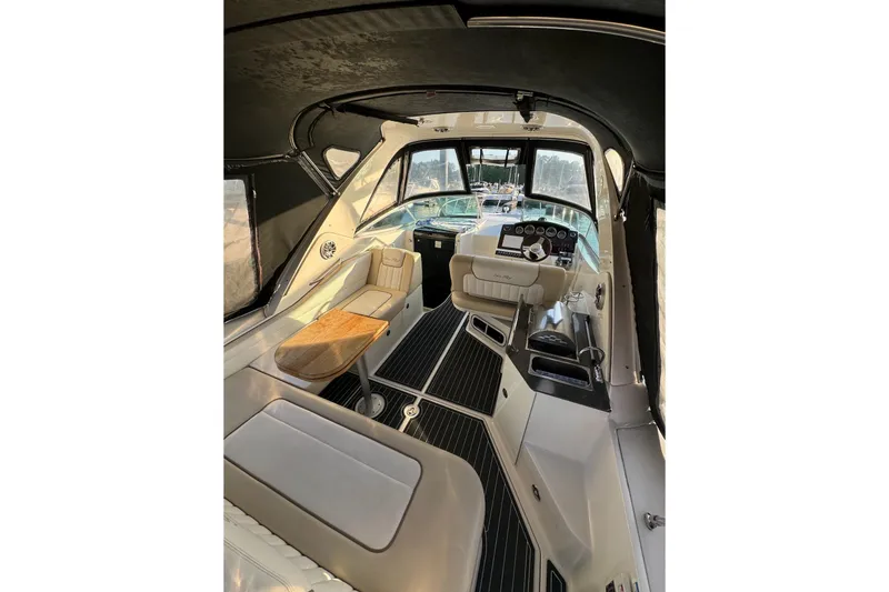 Slide: The Image of Interior of 2012 Sea Ray Sundancer 310 yacht with seating and helm. - 7