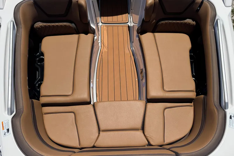 Slide: The Image of Luxurious seating area on 2025 Yamaha Boats 275SE with brown cushions and sleek design. - 14