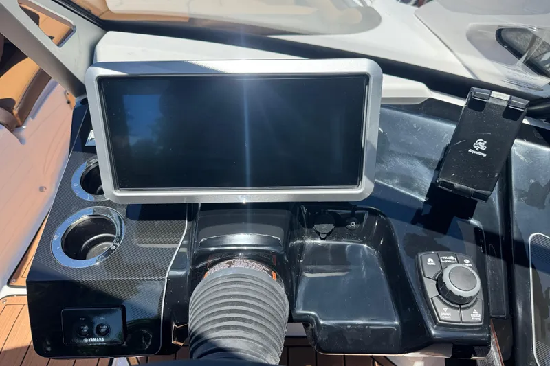 Slide: The Image of Dashboard of 2025 Yamaha Boats 275SE with touchscreen and controls. - 24