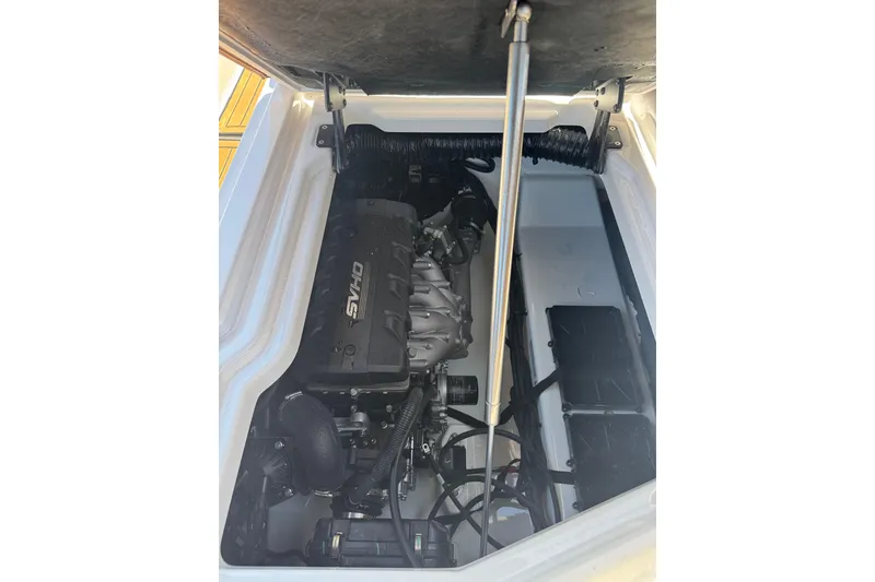 Slide: The Image of Engine compartment of 2025 Yamaha Boats 275SE, showcasing powerful motor and components. - 29