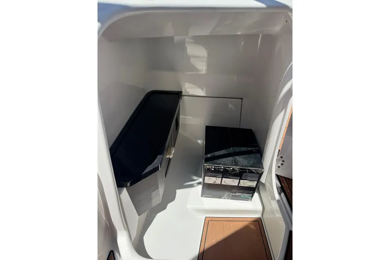 Slide: The Image of Interior storage compartment of 2025 Yamaha Boats 275SE, featuring sleek design and modern amenities. - 33