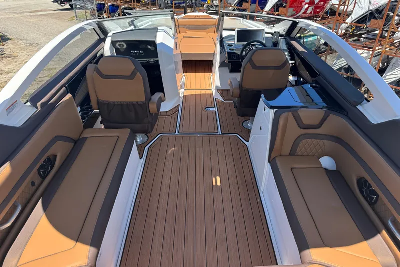 Slide: The Image of 2025 Yamaha Boats 275SE interior with luxurious seating and sleek design. - 7