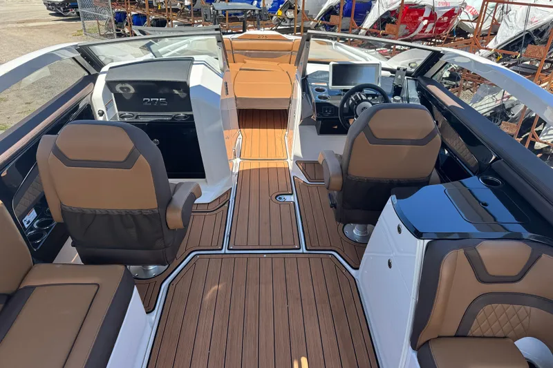 Slide: The Image of 2025 Yamaha Boats 275SE interior with luxurious seating and modern dashboard design. - 8