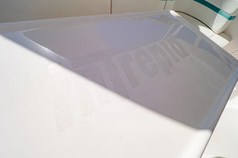 Slide: The Image of 2018 Intrepid 475 Sport Yacht deck with subtle branding in sunlight. - 107