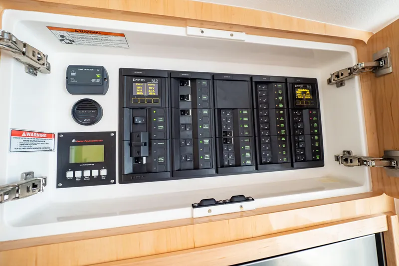 Slide: The Image of Electrical control panel on 2018 Intrepid 475 Sport Yacht, featuring various switches and indicators. - 116