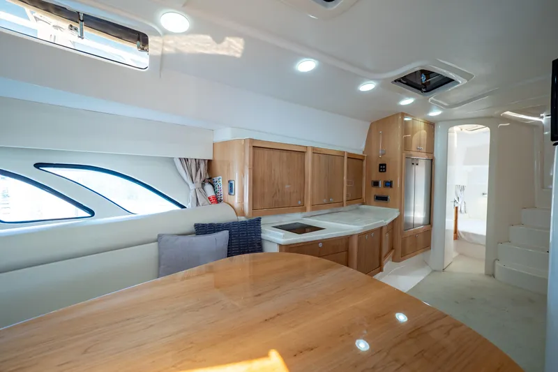 Slide: The Image of Luxurious interior of 2018 Intrepid 475 Sport Yacht with modern kitchen and seating area. - 126