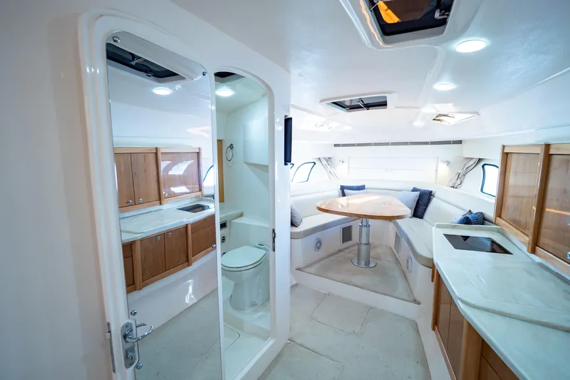 Slide: The Image of Luxurious interior of 2018 Intrepid 475 Sport Yacht with modern kitchen and seating area. - 127
