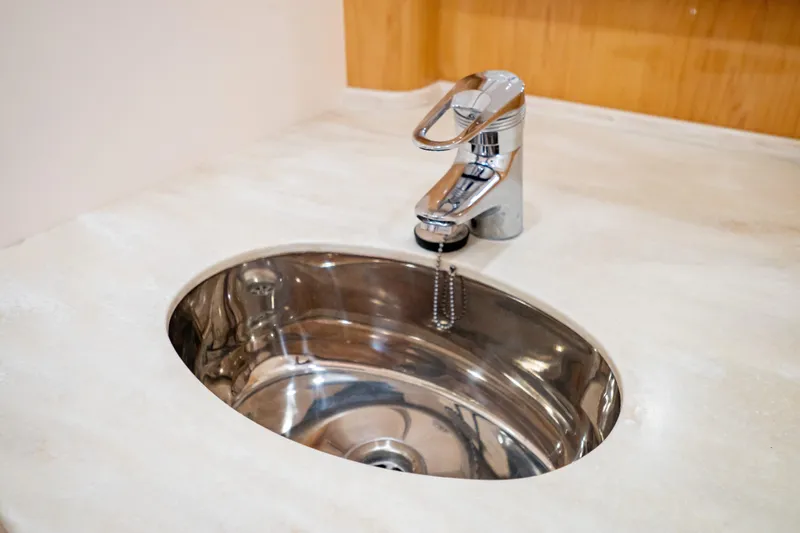 Slide: The Image of Stainless steel sink and faucet on 2018 Intrepid 475 Sport Yacht. - 128