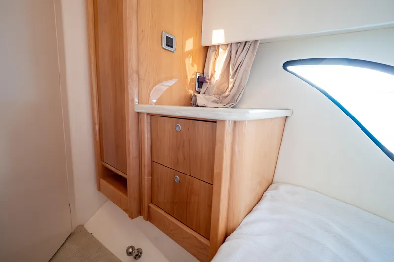 Slide: The Image of Interior of 2018 Intrepid 475 Sport Yacht with wooden cabinetry and natural light. - 131