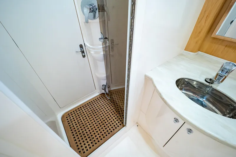 Slide: The Image of Bathroom interior of 2018 Intrepid 475 Sport Yacht with shower and sink. - 135