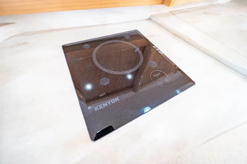 Slide: The Image of Kenyon cooktop in 2018 Intrepid 475 Sport Yacht kitchen area. - 137