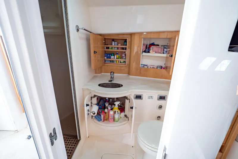 Slide: The Image of Bathroom interior of 2018 Intrepid 475 Sport Yacht with sink, storage, and toilet. - 141