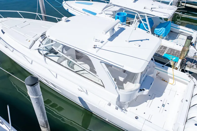 Slide: The Image of 2018 Intrepid 475 Sport Yacht docked at marina, aerial view. - 20