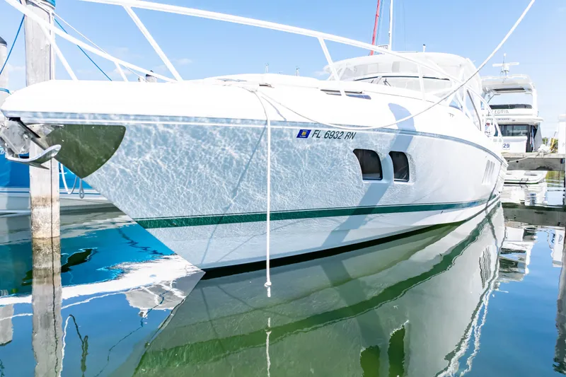 Slide: The Image of 2018 Intrepid 475 Sport Yacht docked, reflecting on calm water. - 22