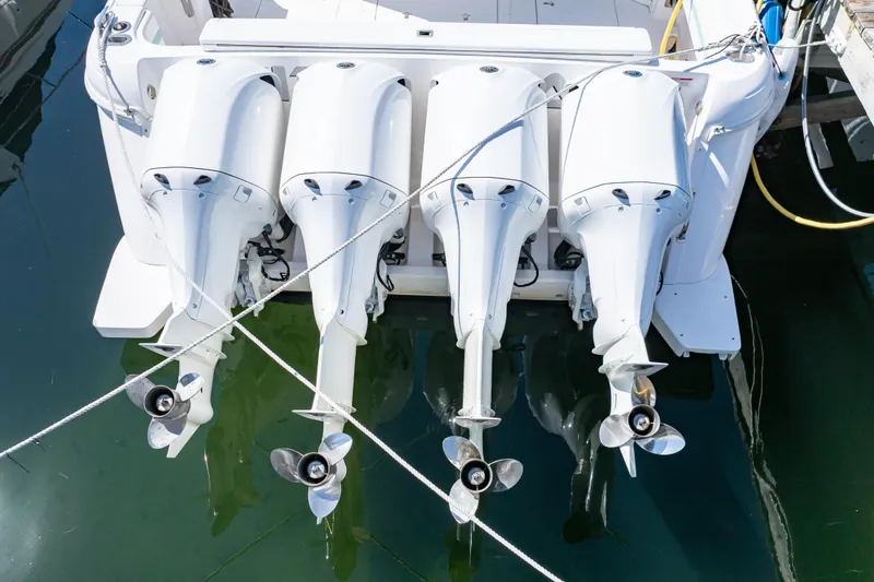 Slide: The Image of 2018 Intrepid 475 Sport Yacht with four powerful outboard engines docked. - 24