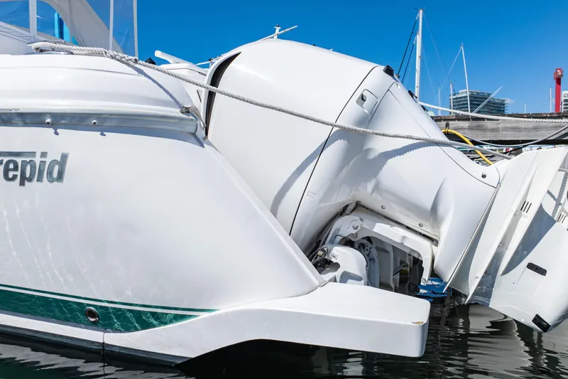 Slide: The Image of 2018 Intrepid 475 Sport Yacht with powerful outboard engines docked at marina. - 26