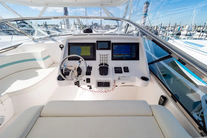 Slide: The Image of 2018 Intrepid 475 Sport Yacht cockpit with modern navigation equipment and luxurious seating. - 3