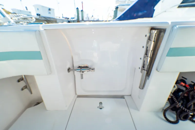 Slide: The Image of 2018 Intrepid 475 Sport Yacht deck area with storage compartment and fittings. - 34