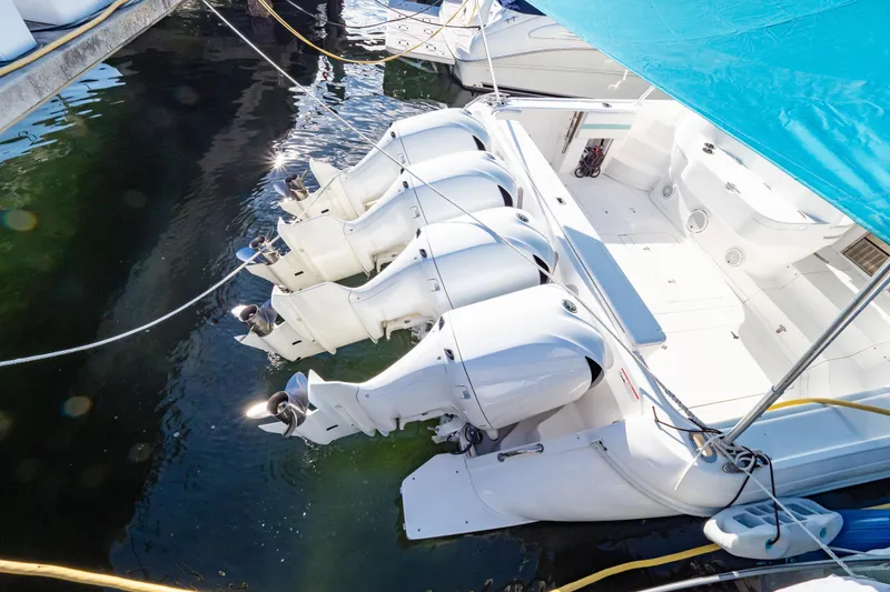 Slide: The Image of 2018 Intrepid 475 Sport Yacht with four powerful outboard engines docked in marina. - 35