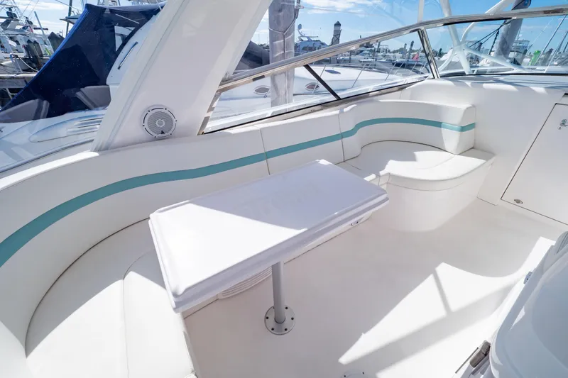 Slide: The Image of Luxurious seating area on 2018 Intrepid 475 Sport Yacht with sleek white and teal design. - 4