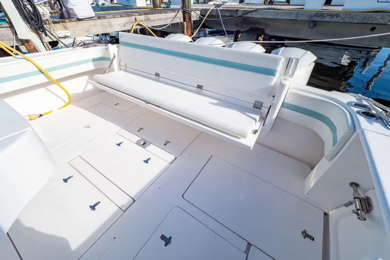 Slide: The Image of 2018 Intrepid 475 Sport Yacht deck with seating and storage compartments. - 41