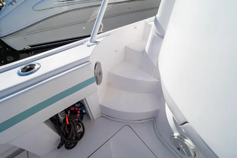 Slide: The Image of 2018 Intrepid 475 Sport Yacht deck with steps and storage compartment. - 49