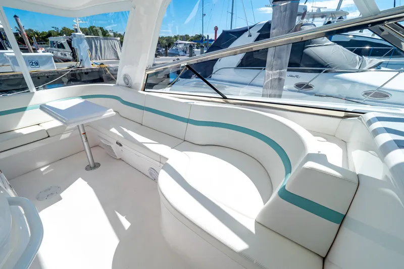 Slide: The Image of Luxurious seating area on a 2018 Intrepid 475 Sport Yacht at a marina. - 5