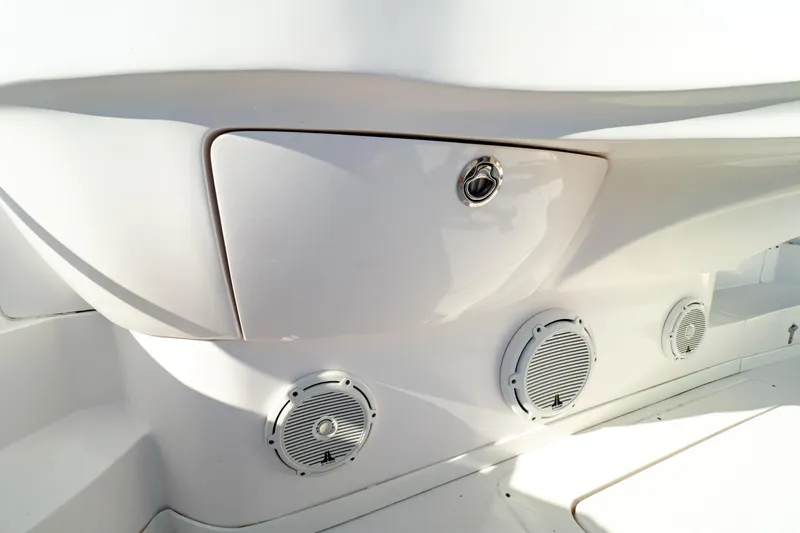 Slide: The Image of 2018 Intrepid 475 Sport Yacht interior detail with speakers and storage compartment. - 51