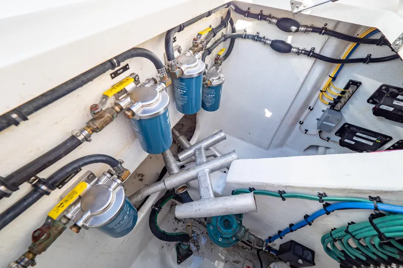 Slide: The Image of Engine compartment of 2018 Intrepid 475 Sport Yacht with fuel filters and wiring. - 58