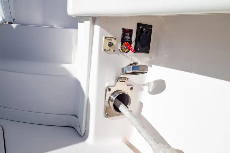 Slide: The Image of 2018 Intrepid 475 Sport Yacht fuel inlet and control panel. - 64