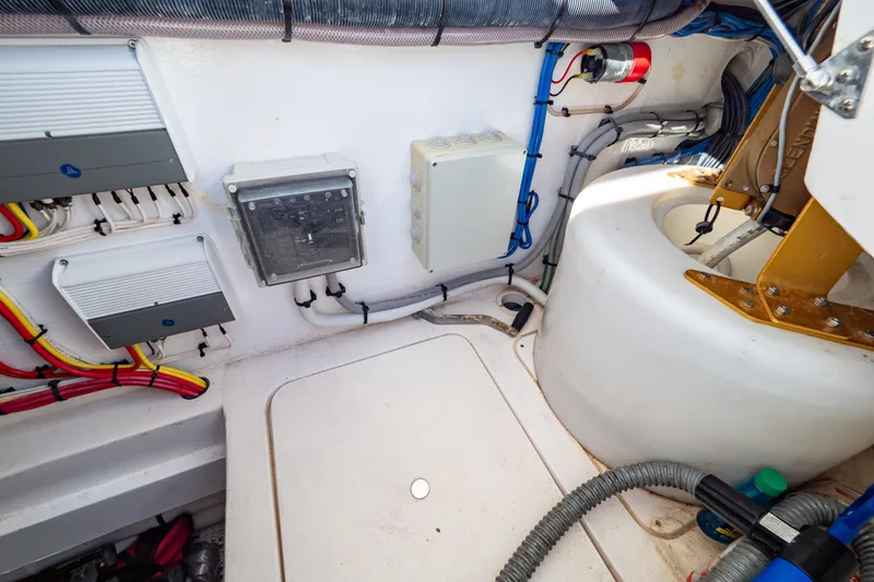 Slide: The Image of Engine room of 2018 Intrepid 475 Sport Yacht with electrical components and wiring. - 66
