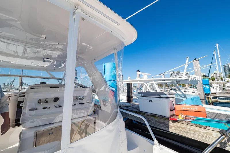 Slide: The Image of 2018 Intrepid 475 Sport Yacht docked, showcasing sleek design and modern features. - 70