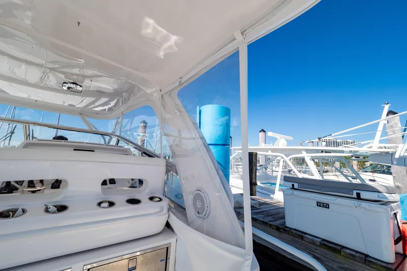 Slide: The Image of 2018 Intrepid 475 Sport Yacht interior with marina view, featuring sleek design and modern amenities. - 71
