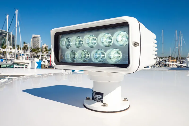 Slide: The Image of LED spotlight on 2018 Intrepid 475 Sport Yacht, docked in a marina. - 82