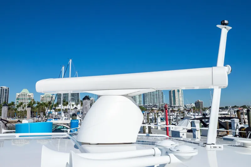 Slide: The Image of 2018 Intrepid 475 Sport Yacht radar system with marina and city skyline background. - 83